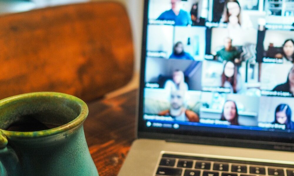 macbook pro displaying group of people